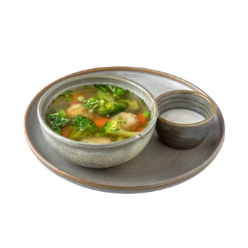 Meatballs and green vegetables soup